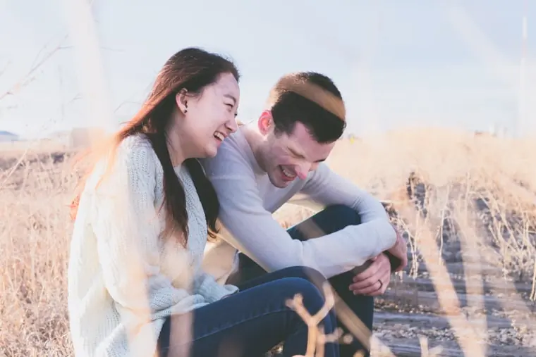 The same kind of easy laughter, outdoors in golden light